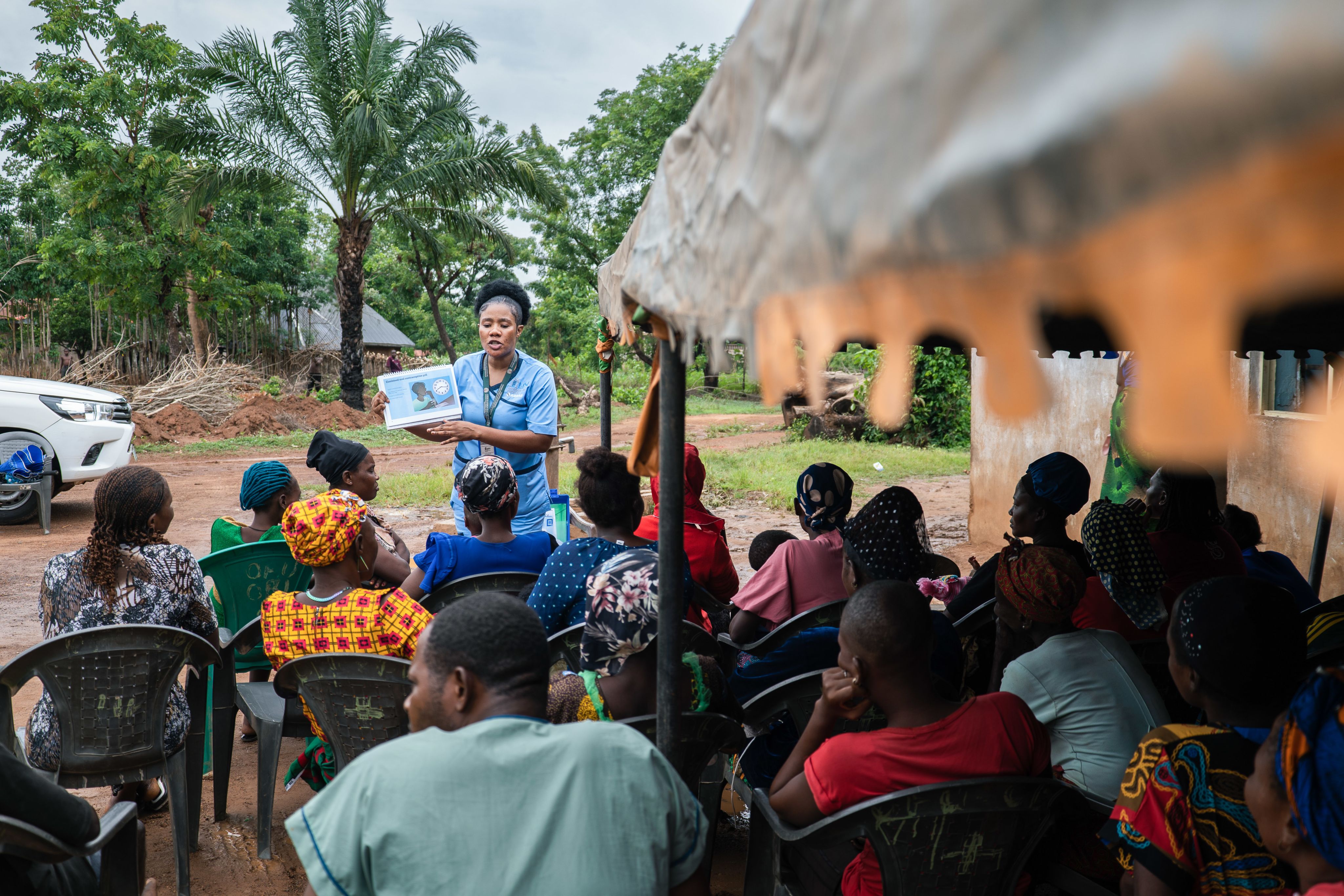 MSI nurse Ify gives an educational talk to community members