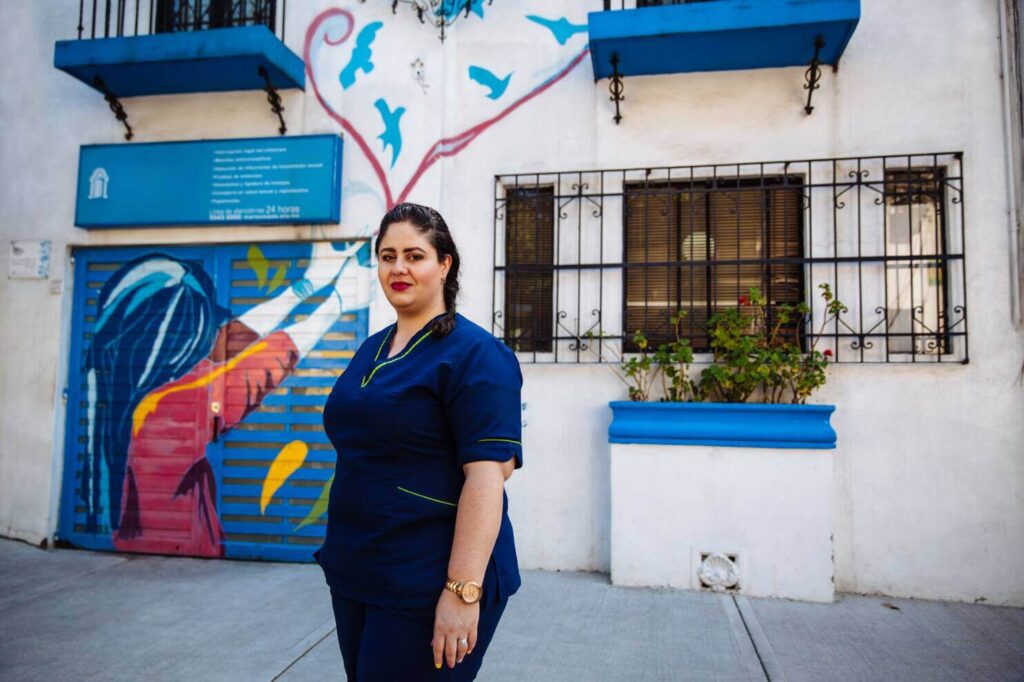 Staff member stands in front of MSI Mexico clinic