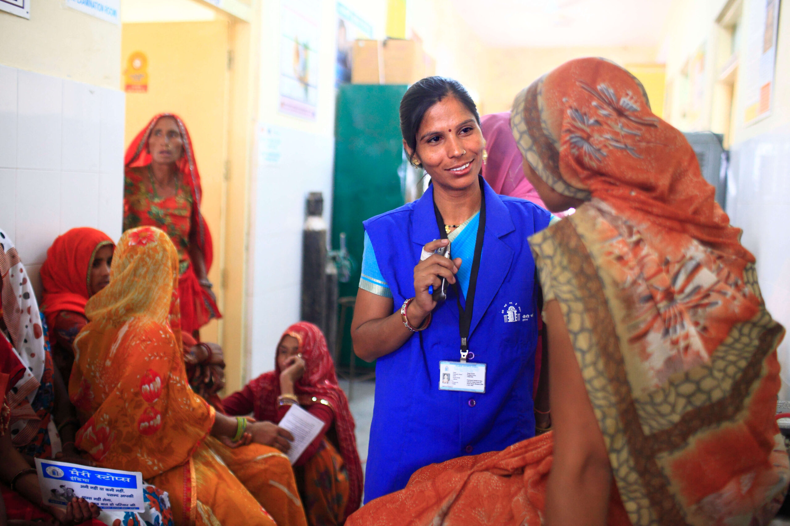 Marie Stopes India team member talks to a group of clients